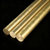 Assorted brass bar profiles including round, square, hex, and flat stock