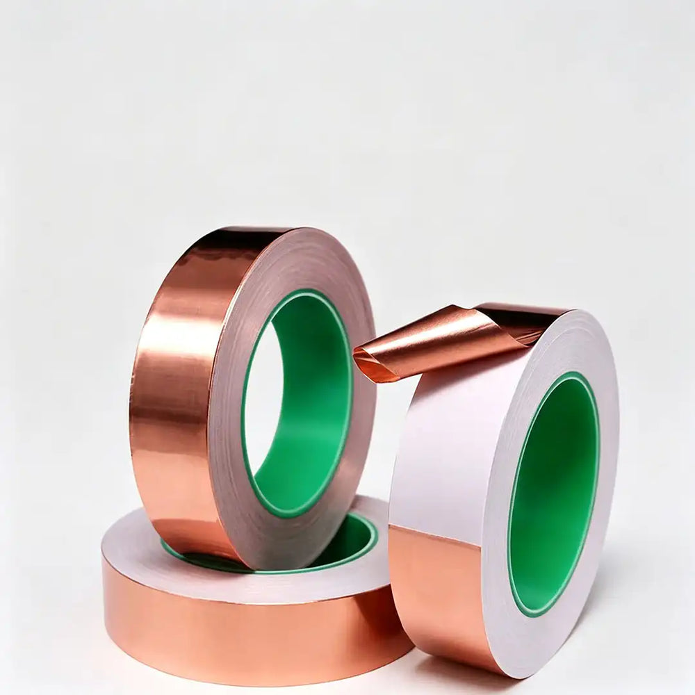 Self-adhesive copper foil tape with conductive adhesive bonding copper to a grounded metal chassis