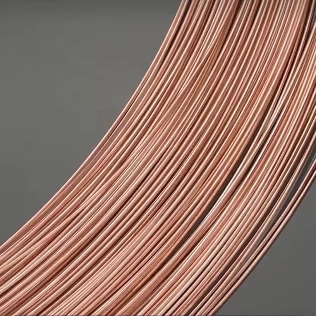 Close-up of bare copper wire showing shiny uncoated surface, no insulation or plating