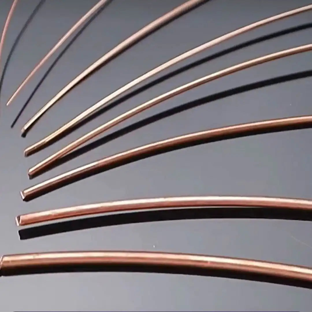 Assortment of pure copper wire in different gauges, from thin fine wire to thick solid wire